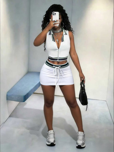 Sleeveless top with exposed navel and lace up short skirt set