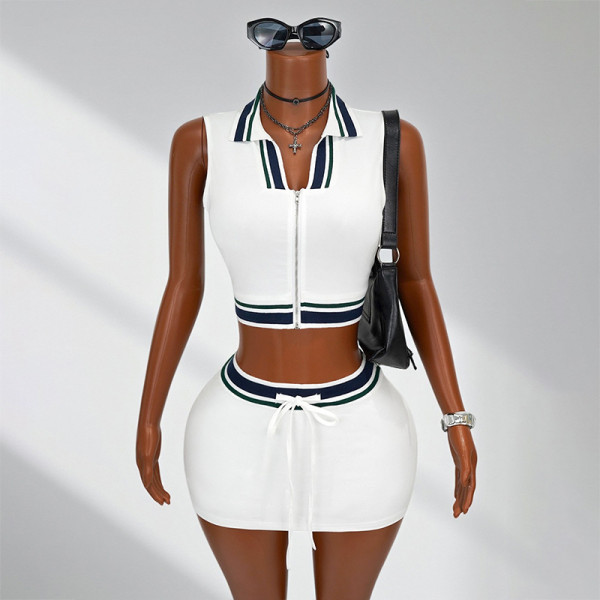 Sleeveless top with exposed navel and lace up short skirt set