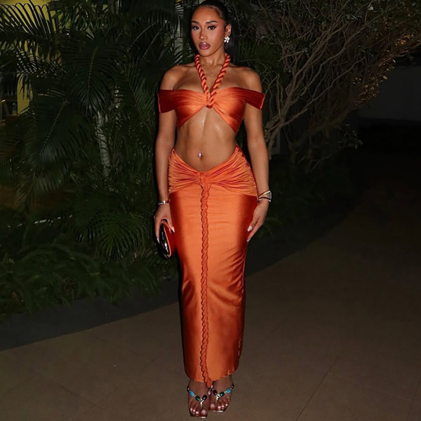 Hanging neck and strapless top with exposed navel long skirt set
