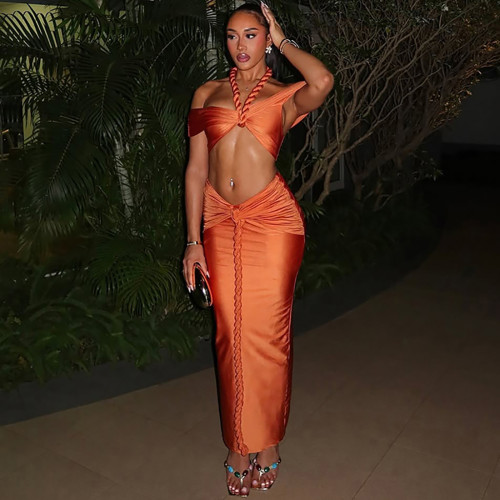 Hanging neck and strapless top with exposed navel long skirt set