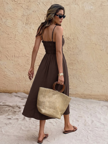 A solid color backless dress with a single neckline camisole and a long skirt