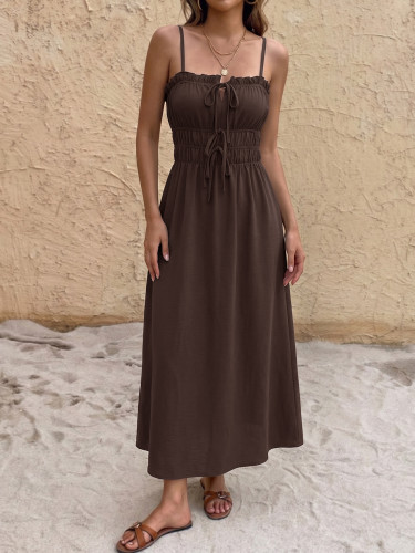 A solid color backless dress with a single neckline camisole and a long skirt