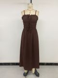 A solid color backless dress with a single neckline camisole and a long skirt