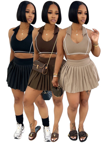 Two piece set of collared tank top lined with safety pants and pleated short skirt