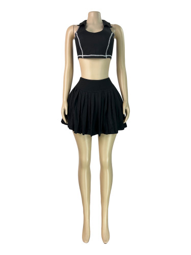 Two piece set of collared tank top lined with safety pants and pleated short skirt