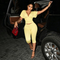 Solid color V-neck pleated half sleeved top, tight fitting cropped pants two-piece set