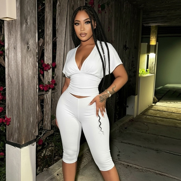 Solid color V-neck pleated half sleeved top, tight fitting cropped pants two-piece set