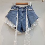 Slanted edge splicing jeans