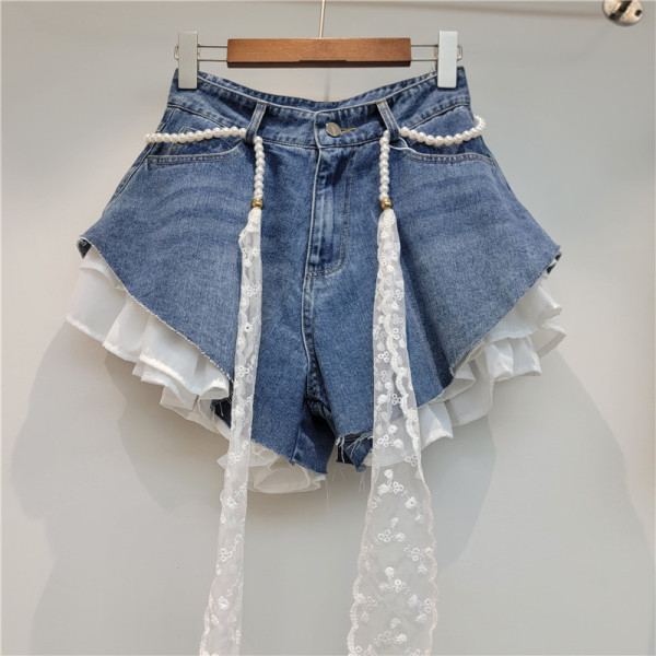 Slanted edge splicing jeans