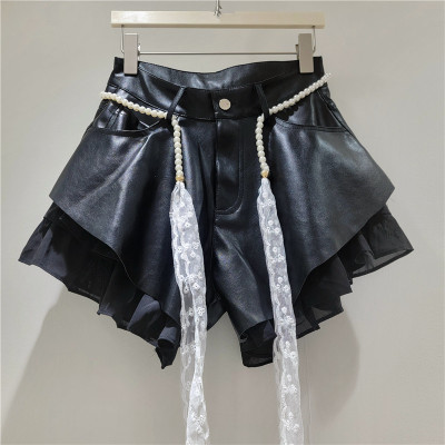 Slanted edge splicing leather pants
