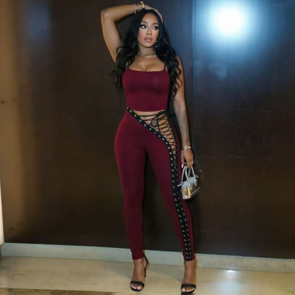 Two piece set of tight pants with hollowed out straps on the side of the sling FC1581