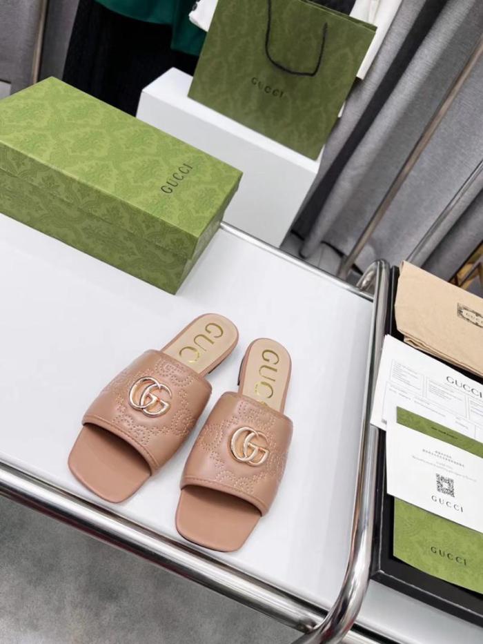 Gucci leather print slides Brown