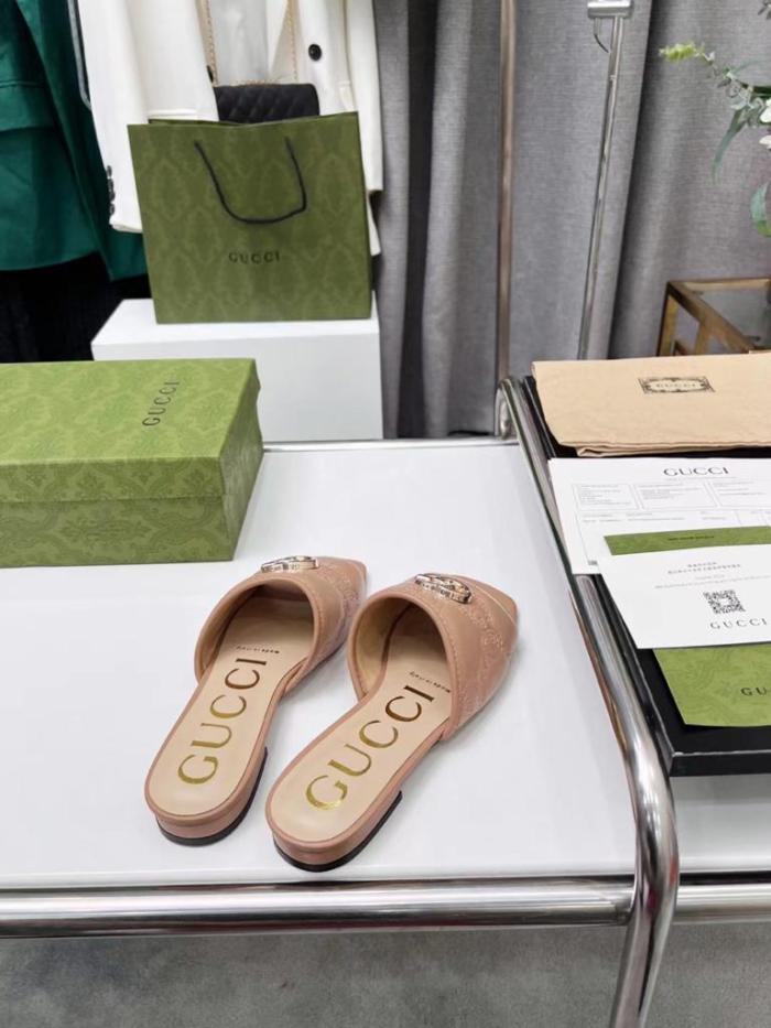 Gucci leather print slides Brown