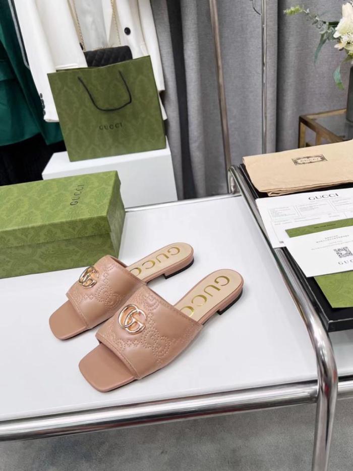 Gucci leather print slides Brown