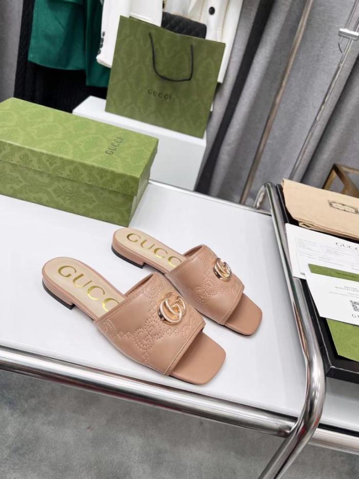 Gucci leather print slides Brown