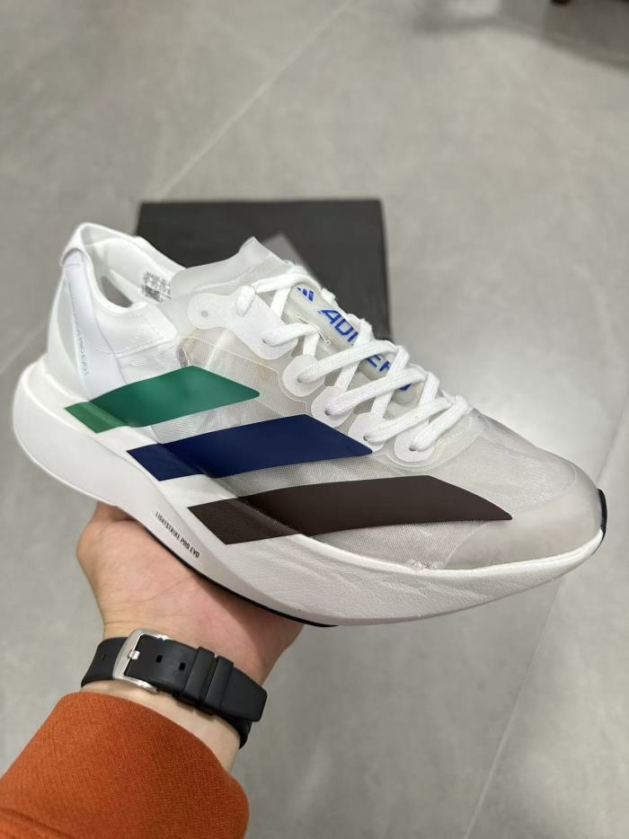 AD x Pharrell Williams  Adizero Adios Pro Evo 1  Earth  LightStrike Pro Transparent Tulle Mesh Marathon Running Sneakers 29336030