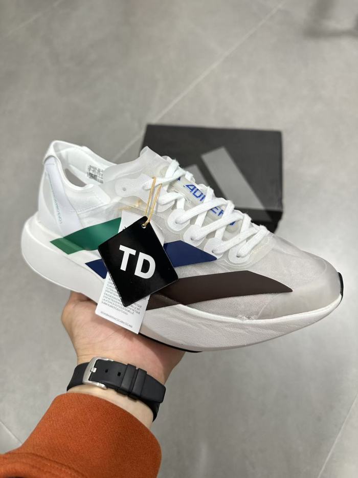 AD x Pharrell Williams  Adizero Adios Pro Evo 1  Earth  LightStrike Pro Transparent Tulle Mesh Marathon Running Sneakers 29336030