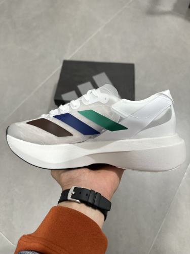 AD x Pharrell Williams  Adizero Adios Pro Evo 1  Earth  LightStrike Pro Transparent Tulle Mesh Marathon Running Sneakers 29336030