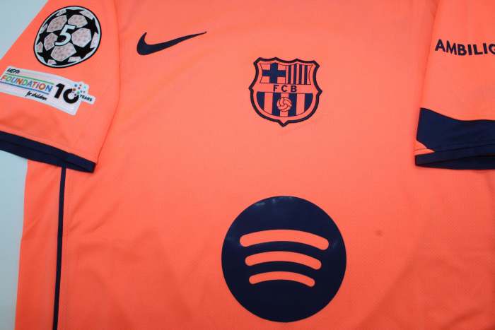 with UCL Patch Barca Camisetas de Futbol Fans Version 2025-2026 Barcelona Third Away Orange Soccer Jersey