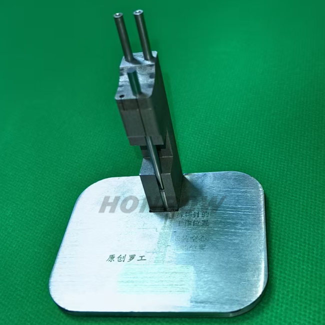 Pin Punching Stand This convenient and practical pinning station is made entirely of stainless steel, hand-ground and polished. The pin extractor needle is made of superior tool steel